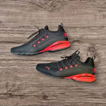 Black Puma athletic shoes